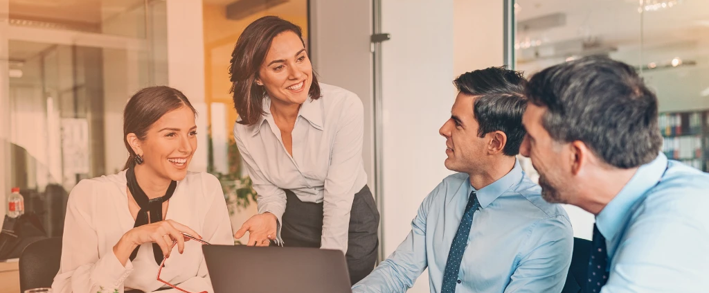 Group of business professionals discussing HR and payroll budgeting for 2026