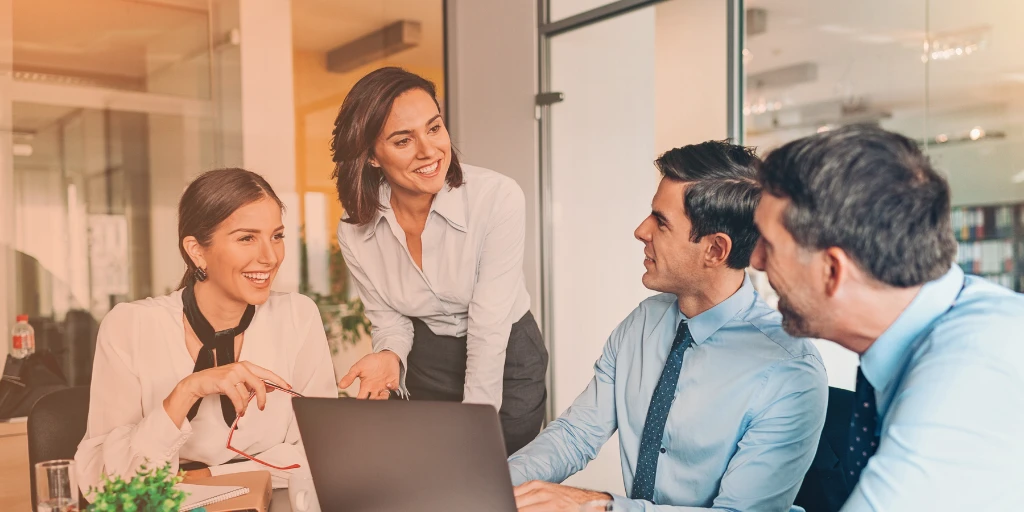Group of business professionals discussing HR and payroll budgeting for 2026