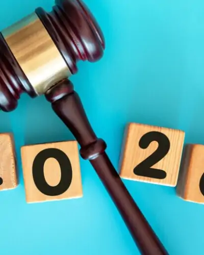 Gavel with “2026” symbolizing employer compliance guide 2026 for payroll, and benefits regulations